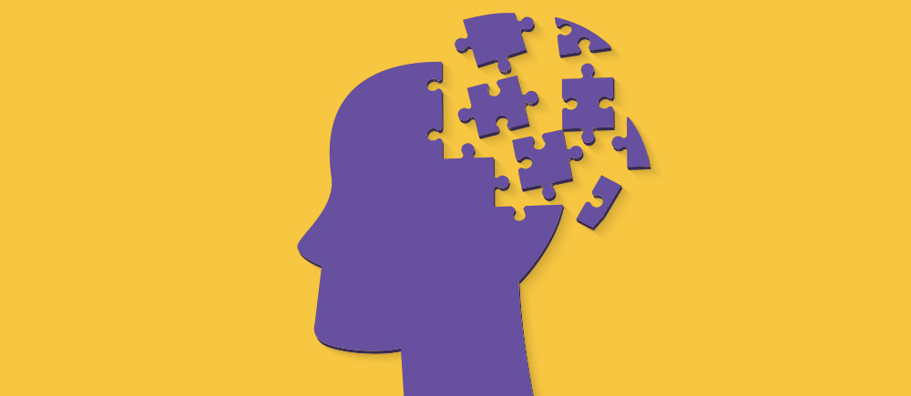 Illustration of a silhouette of a human head. A portion of the silhouette is made of puzzle pieces.